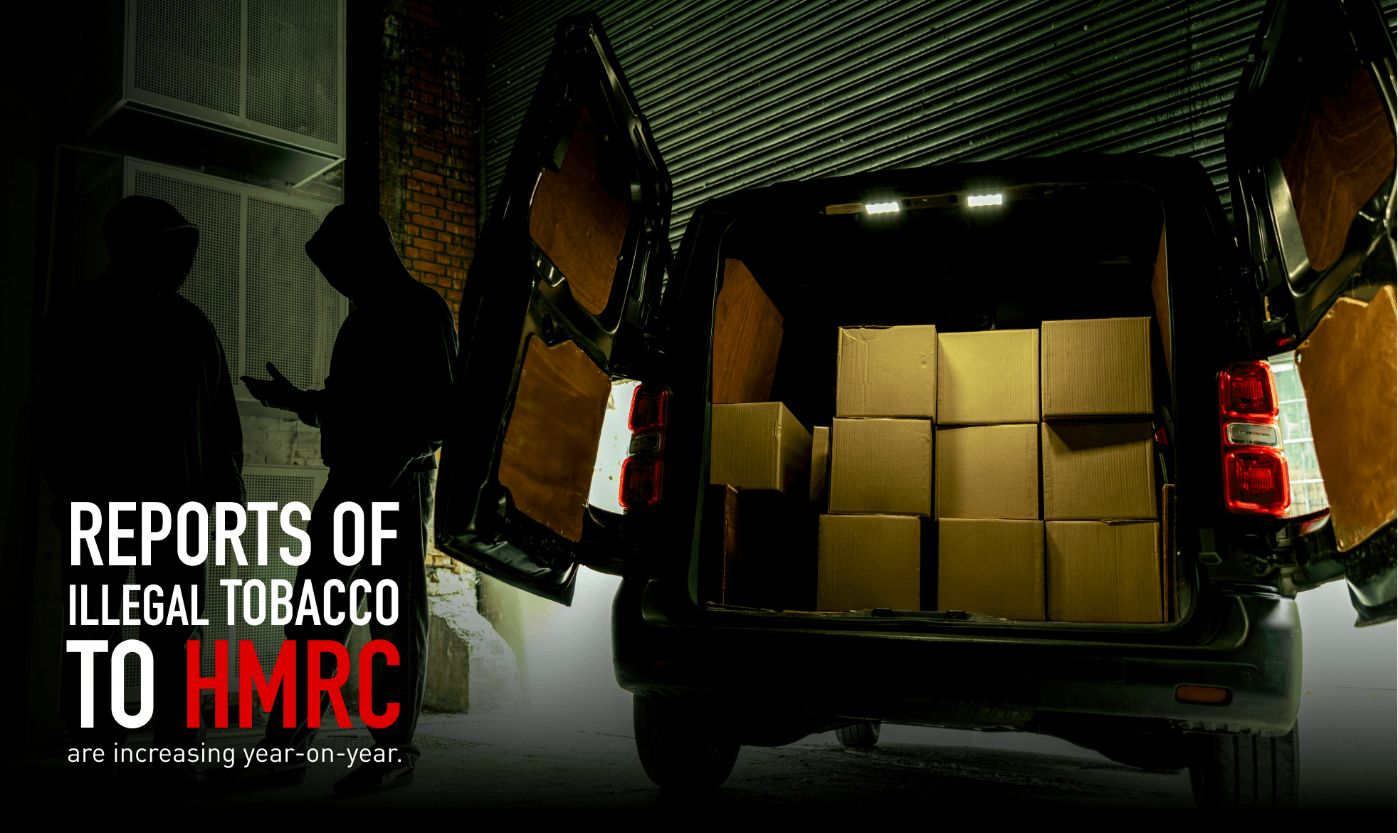 men in hoods packing boxes into and out of van